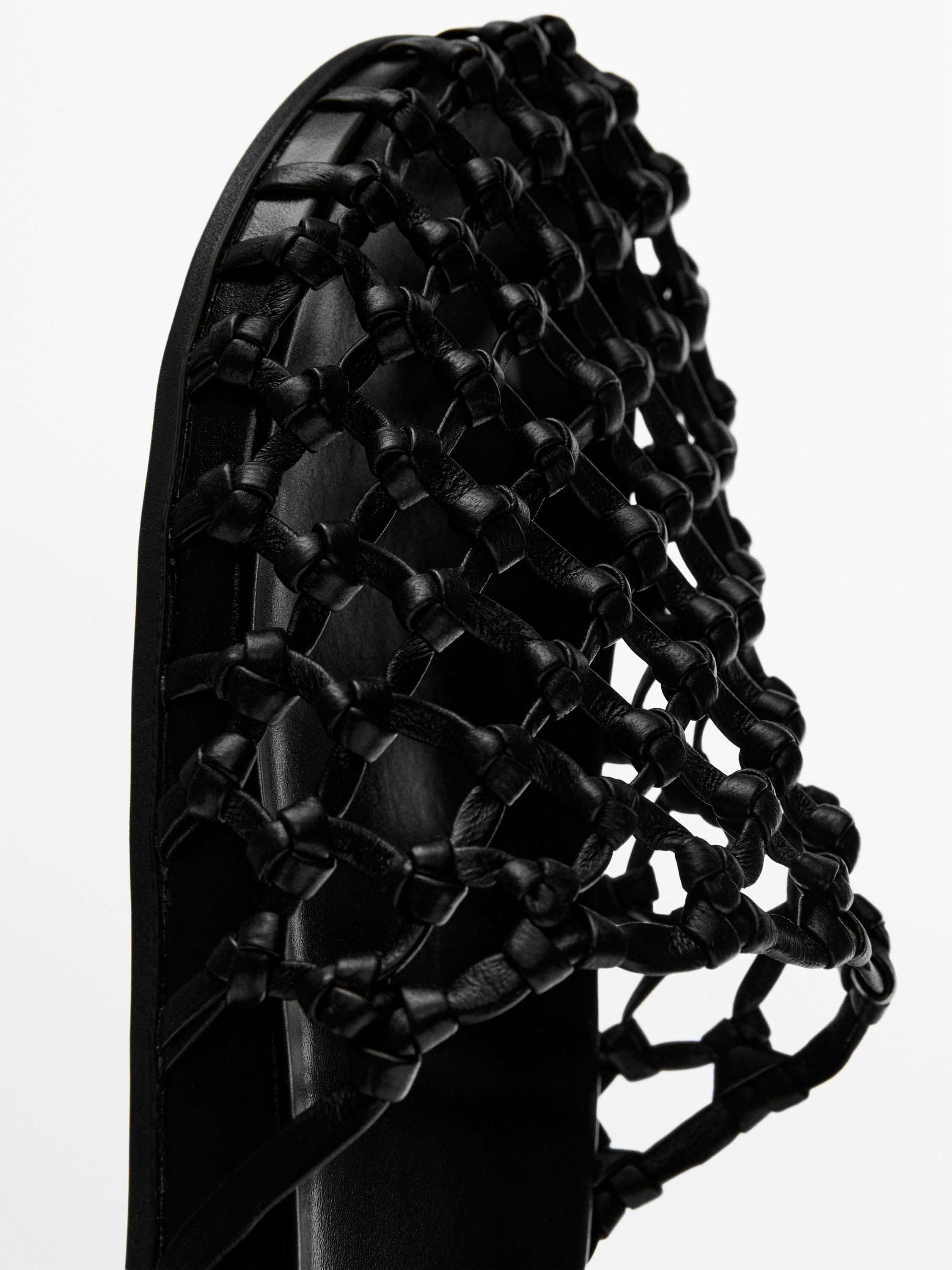 Woven leather clogs
